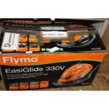 A boxed Flymo Easy Glide lawnmower