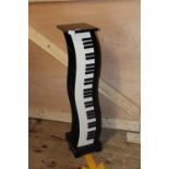 A piano keyboard style wooden storage unit. Postage unavailable 93cm tall