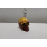 A amber style skull figure