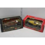 Two boxed Burago die-cast models