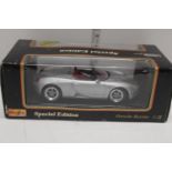 A large boxed Maisto die-cast model