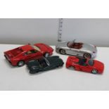 Four assorted die-cast car models