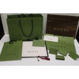 A selection of Gucci packaging including 8.5ft ribbon