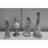 Four ceramic ladies figures (all with different makers names)