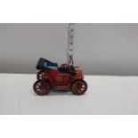 A vintage Modern Toys tinplate lever driven car