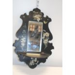 An antique Victorian wall hanging mirror and shelf