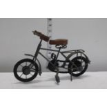 A metal model of a vintage bicycle