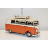 A tin plate model of a VW camper van