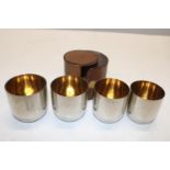 A set of five vintage stirrup cups in a leather case