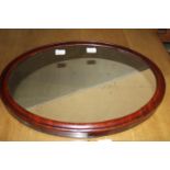 A antique oval framed mirror. Postage unavailable