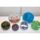 A large selection of assorted paper weights including Caithness.