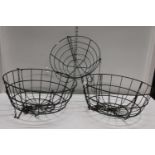 Three green metal wire hanging baskets