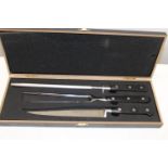 A boxed Sabatier carving set