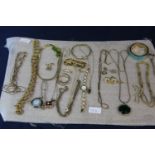 A selection of assorted gold tone costume jewellery