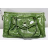 A Ladies green fashion bag