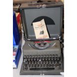 A vintage Imperial portable typewriter. Postage unavailable