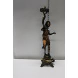 A bronzed spelter figure converted into a table lamp
