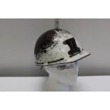 A vintage Bakelite miners helmet