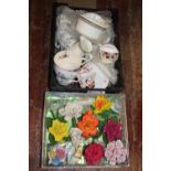 Two boxes of assorted ceramics including capotopodipmi flowers. Postage unavailable