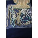 Selection of vintage and modern pearl necklaces