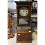 A oak cased international time recording company clock (needs attention) no postage available.