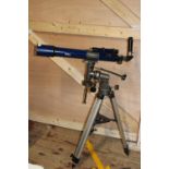 A skylux telescope and tripod. Postage unavailable