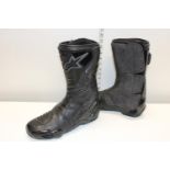 A pair of alpine stars motorbike boots sized 42