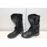 A pair of teknic motorbike boots sized 42