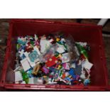 A large box of Lego style models and bricks