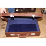 A vintage Toye and Co leather suitcase