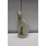 A heavy terracotta and glazed cat figurine. Postage unavailable