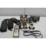 A selection of vintage mobile phones and other items