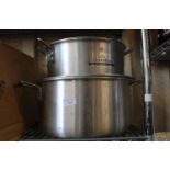 Two large stainless steel kitchen pans