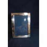 A hallmarked silver photo frame