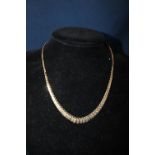 A graduated 9ct gold necklace 4.44 grams