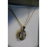 A 9ct gold chain and pendant with blue and white stone decoration 3.55 grams