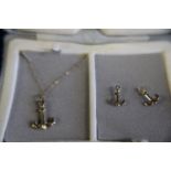 A 9ct gold necklace and earing set