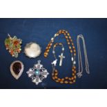 A selection of vintage costume jewellery including a silver brooch