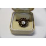 A 9ct gold garnet and pearl cluster ring