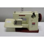 A vintage Vulcan countess child's sewing machine