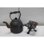 vintage copper kettle and cast iron trivet