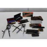A collection of vintage razors ect.