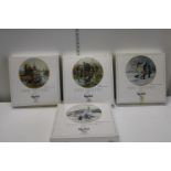 Four boxed collectors plates