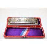 A boxed super chromonic harmonica