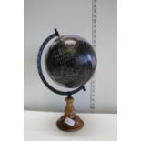 A world globe on a wooden base