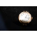 A 9ct gold bodied watch gross weight 12.34 grams