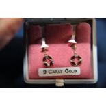 A pair of 9ct gold garnet earrings