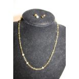 A gold plated necklace and earring set