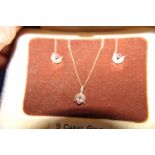 A 9ct gold necklace and earring set with rubies