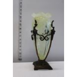 A Art Nouveau Vaseline glass vase in tapered form in a metal stand. Slight damage to glass rim